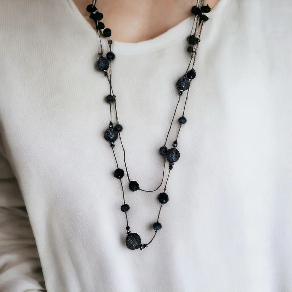 Long elegant black necklace with net over glass beads